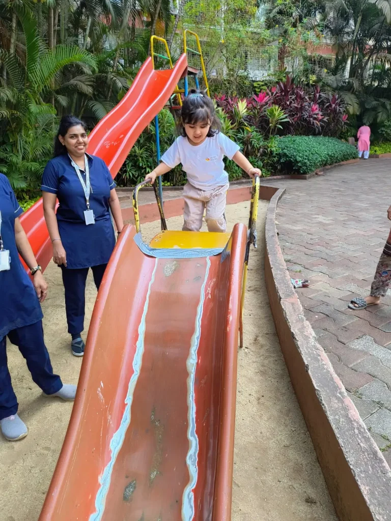 Children climbing slides in playground