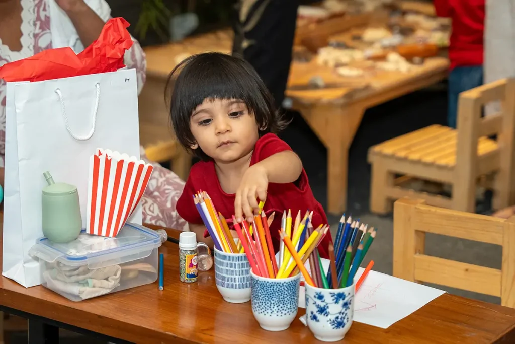 Toddlers engaged in Christmas crafts