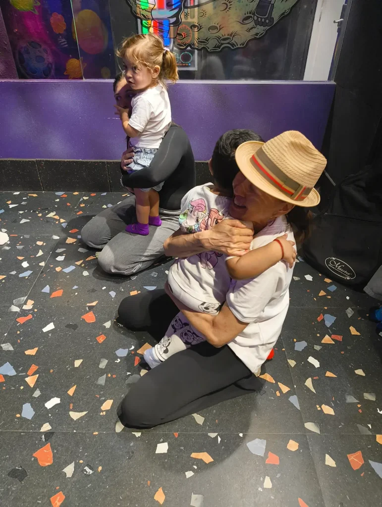 Facilitator interacting with child during play