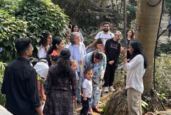 Parents and children exploring a garden together at Circles & Cycles preschool in Bandra, Mumbai