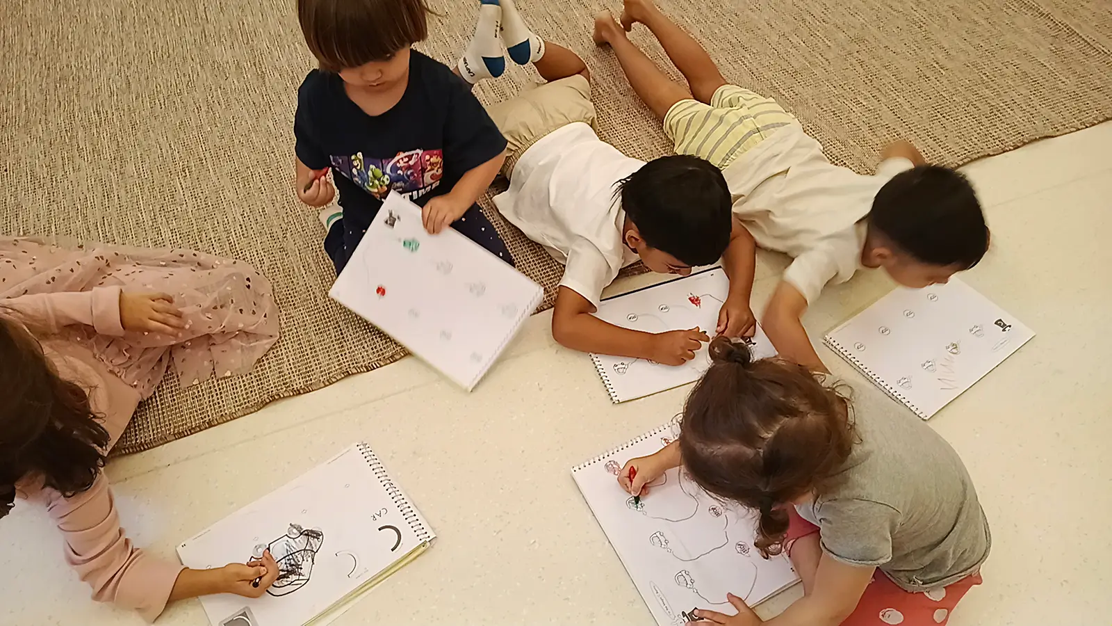 Children expressing ideas through drawing and construction at Circles & Cycles, Bandra