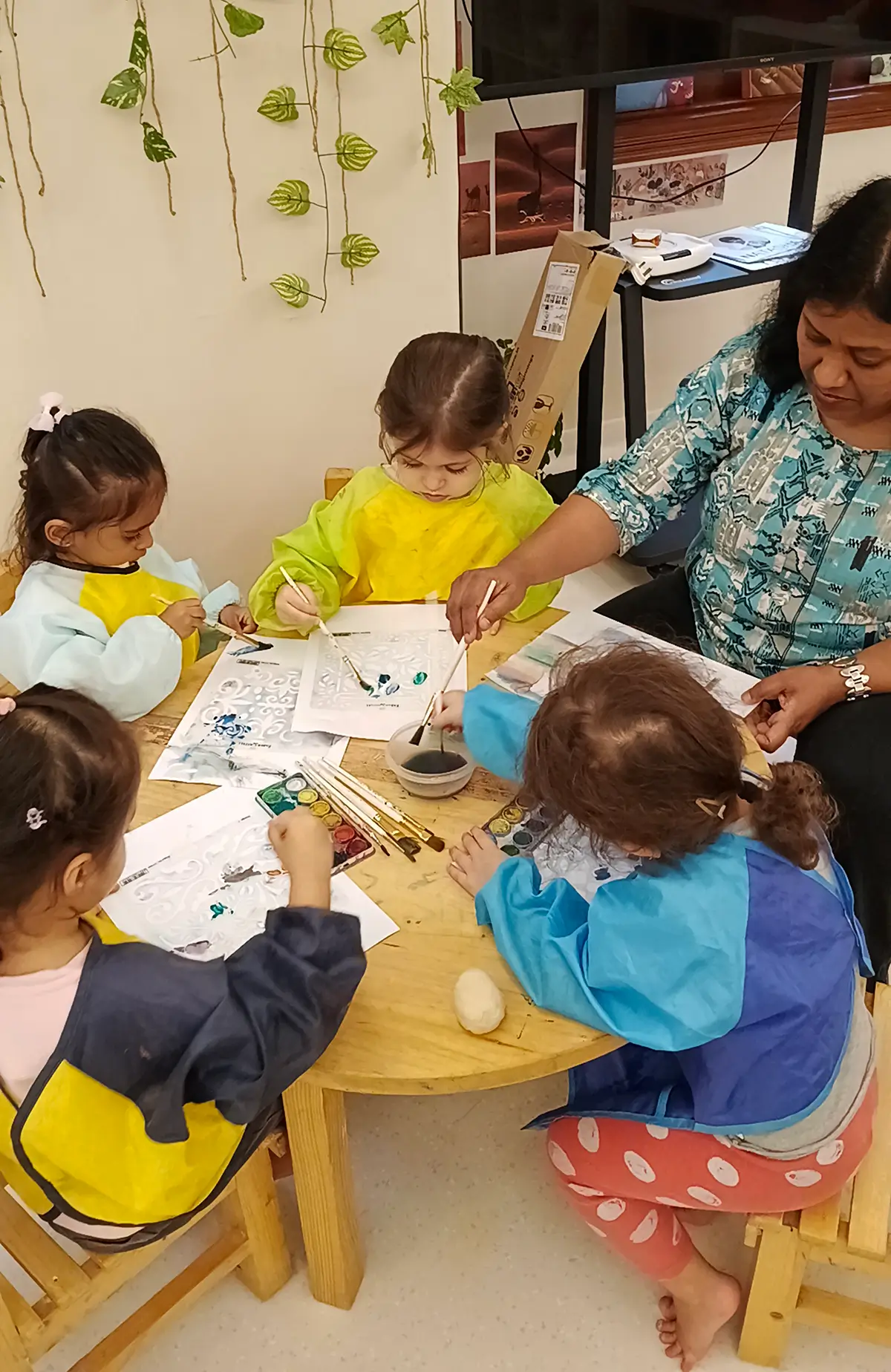 Preschooler testing her own idea with open-ended materials at Circles & Cycles, Bandra