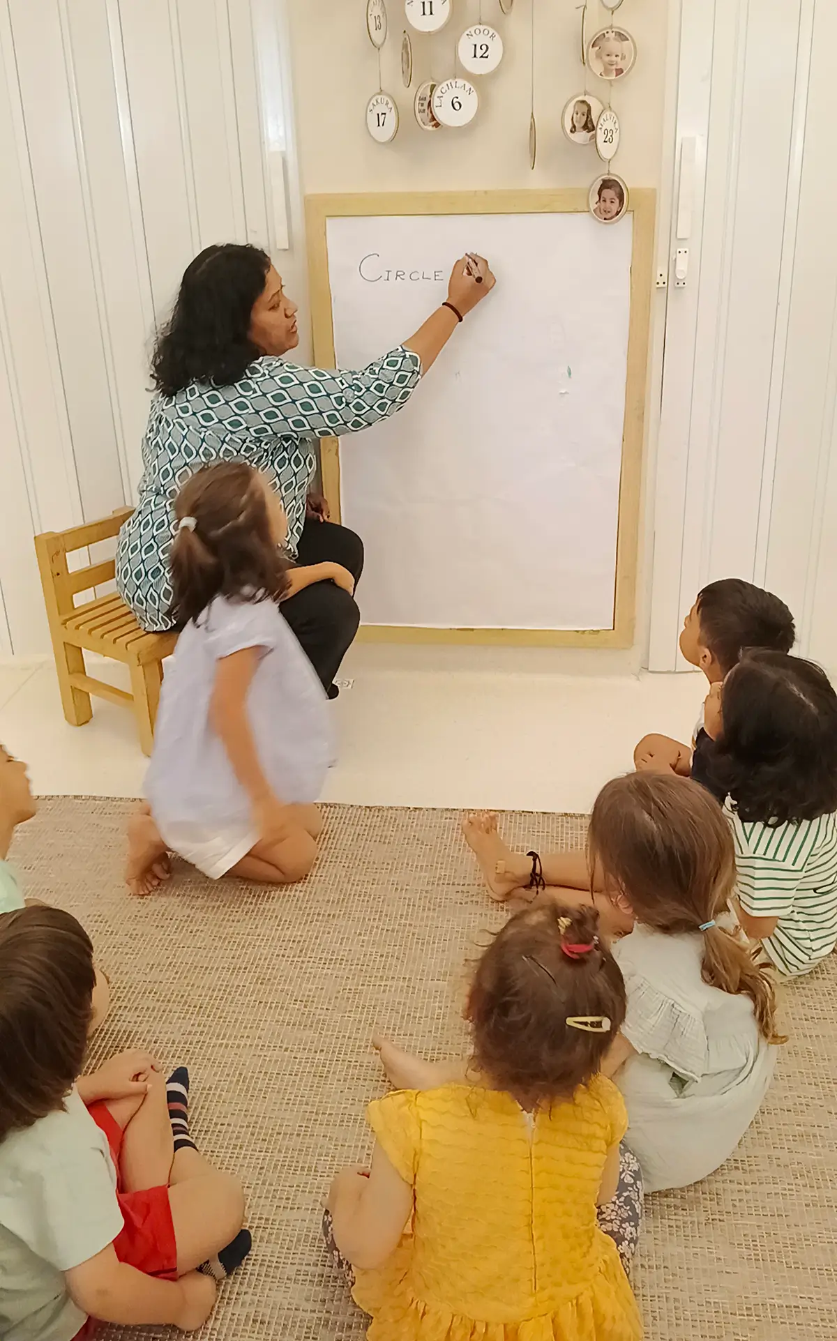 Facilitator following a child's emerging interest during an investigation at Circles & Cycles, Bandra