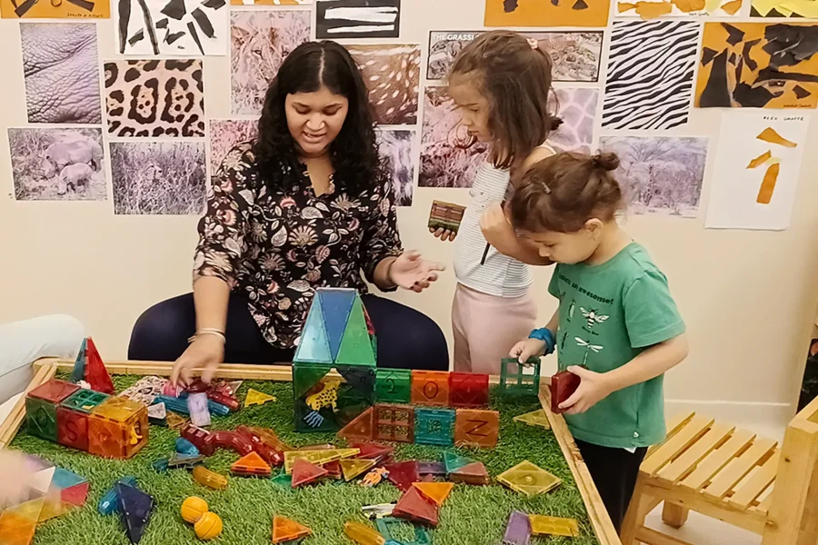 Reggio Emilia facilitator observing preschoolers during an investigation at Circles & Cycles, Bandra