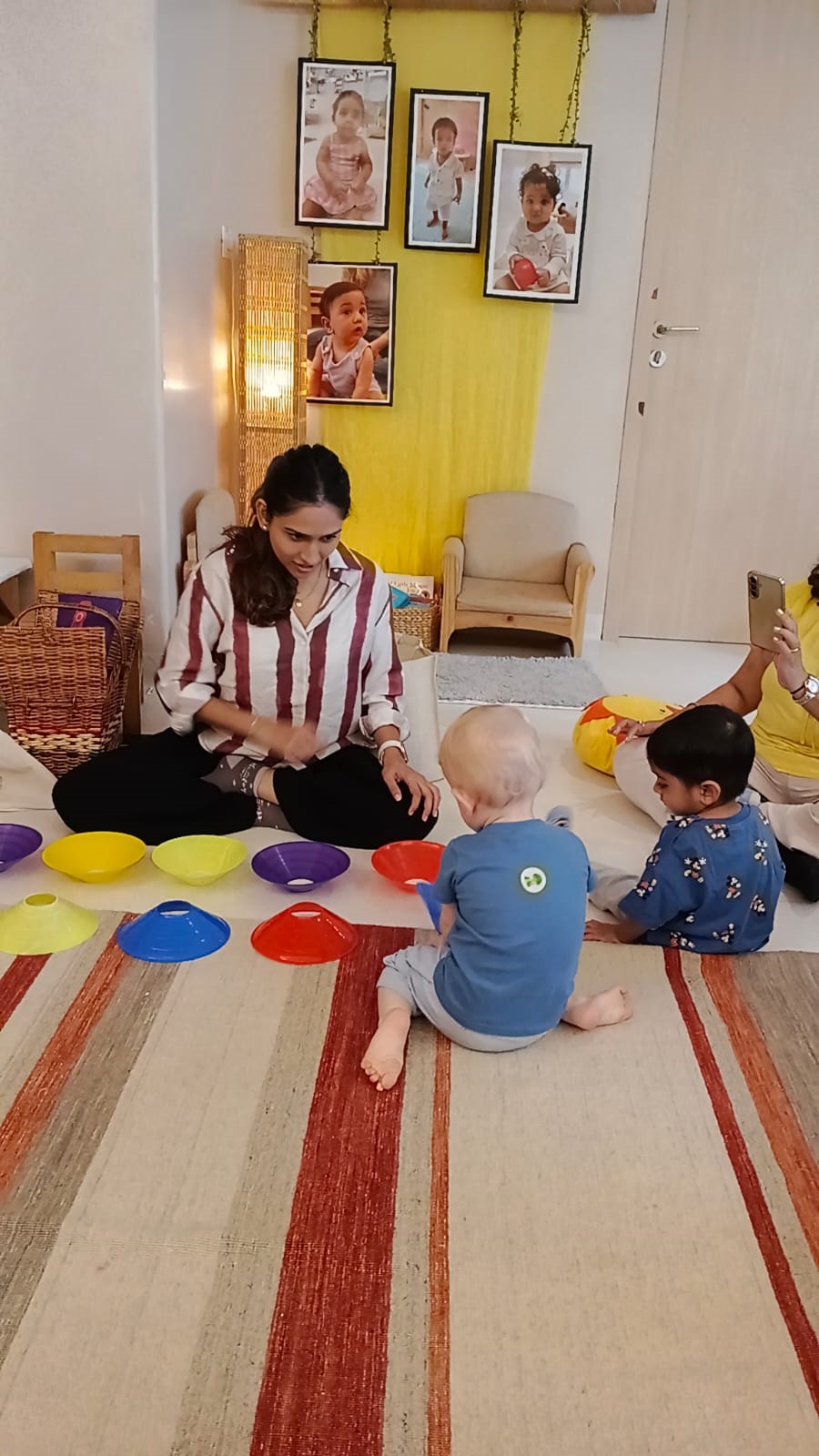 Facilitator sitting at a child's level and listening at Circles & Cycles, Bandra