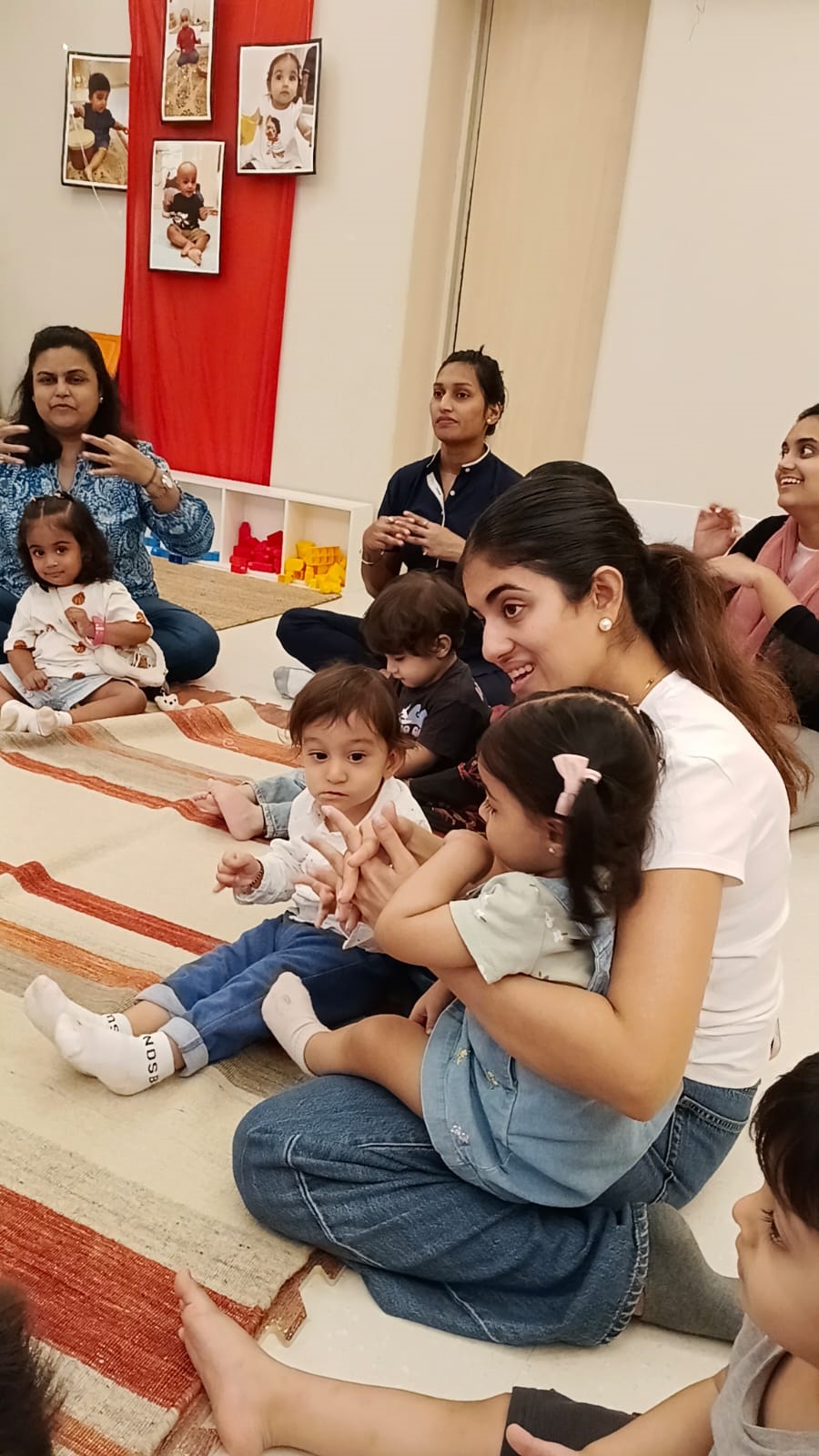 Adults and children together in a warm, homely classroom at Circles & Cycles, Bandra