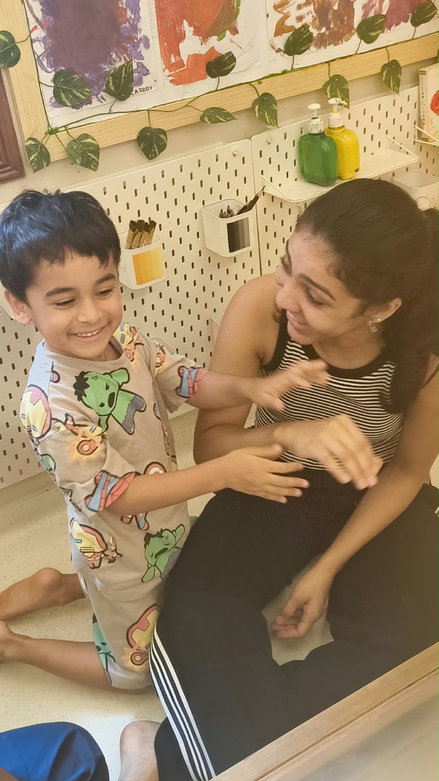Toddler and facilitator reconnecting after a difficult moment at Circles & Cycles, Bandra