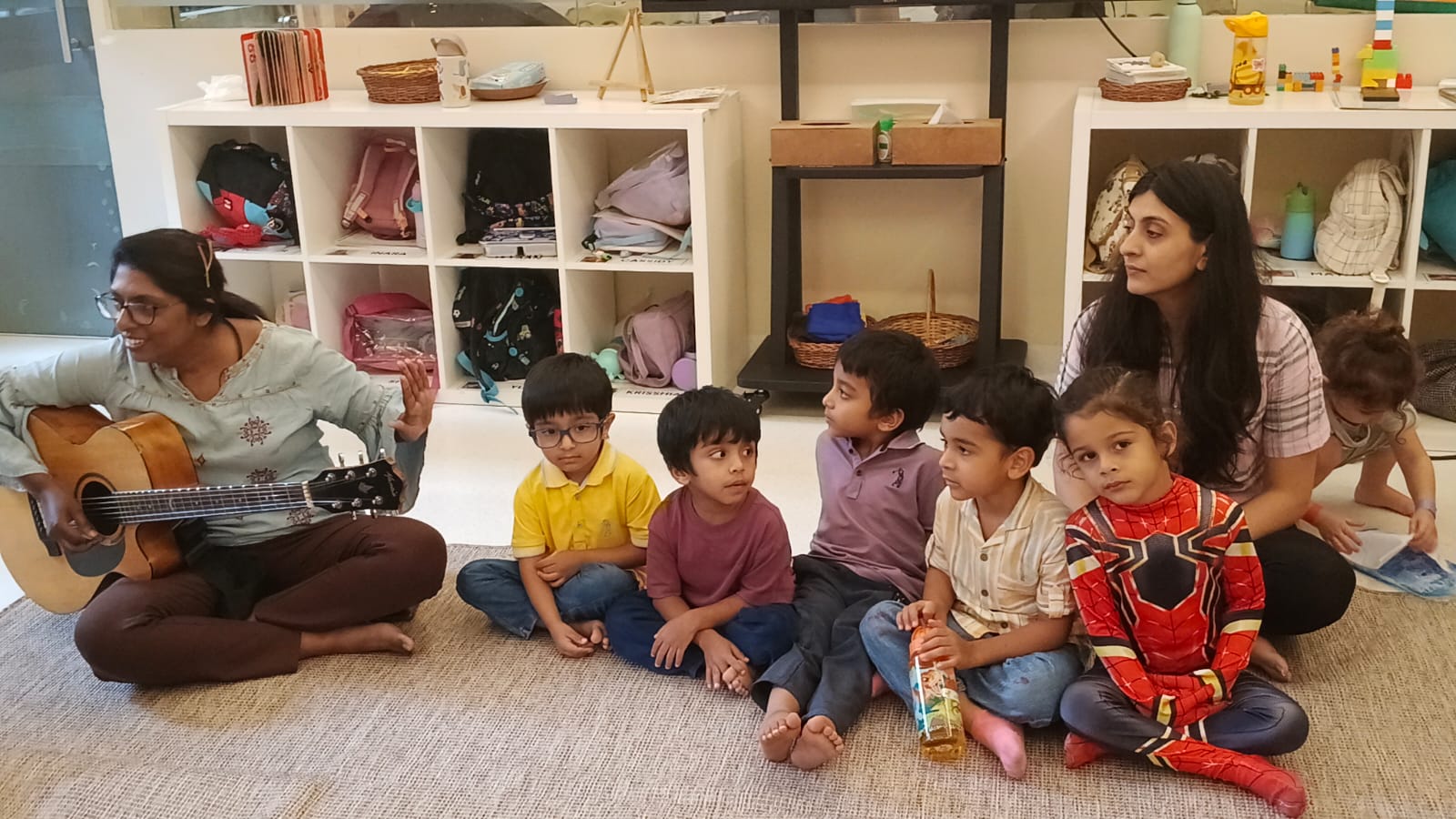 Facilitator calmly supporting a toddler through a big feeling at Circles & Cycles, Bandra